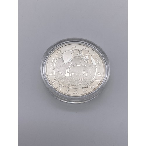 401 - BOX OF 12 ONE OUNCE SILVER BRITANNIA COMMEMORATIVE CROWNS, AND A SILVER ONE DOLLAR KOOKABURRA