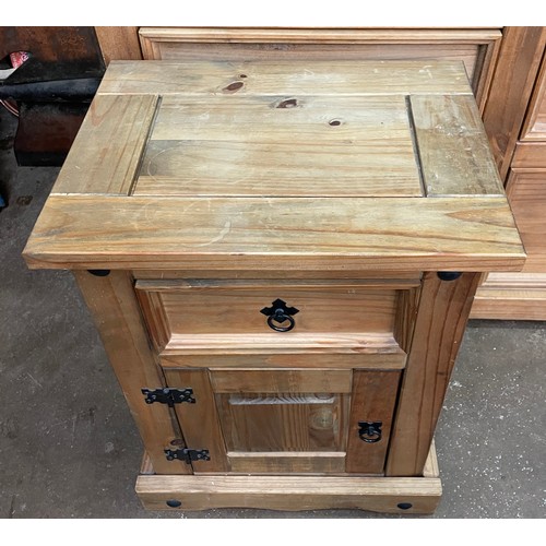 136 - COLONIAL PINE BEDSIDE CUPBOARD WITH METAL STUDDED MOUNTS