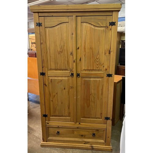 138 - COLONIAL PINE FIELDED PANEL TWO DOOR WARDROBE WITH DRAWER BASE