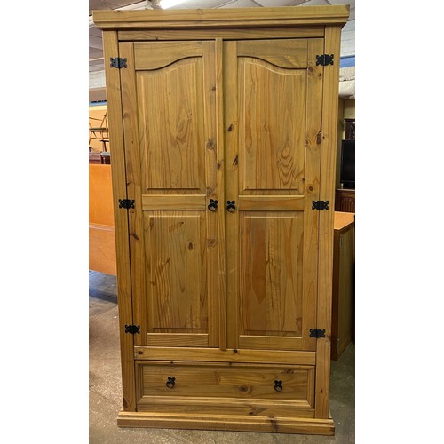 138 - COLONIAL PINE FIELDED PANEL TWO DOOR WARDROBE WITH DRAWER BASE