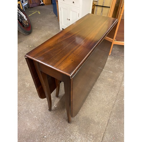 92 - REGENCY STYLE MAHOGANY DROP FLAP DINING TABLE