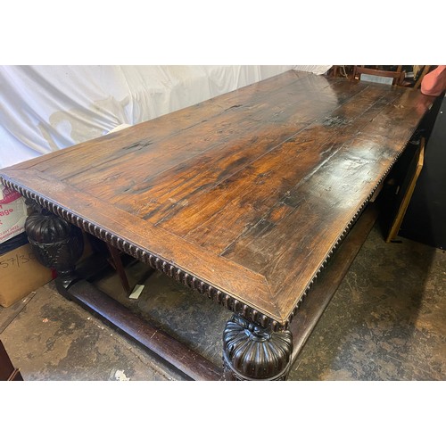 166 - 17TH CENTURY AND LATER OAK REFECTORY TABLE WITH A FIVE PLANK CLEATED TOP WITH CARVED EDGE ON HEAVILY... 