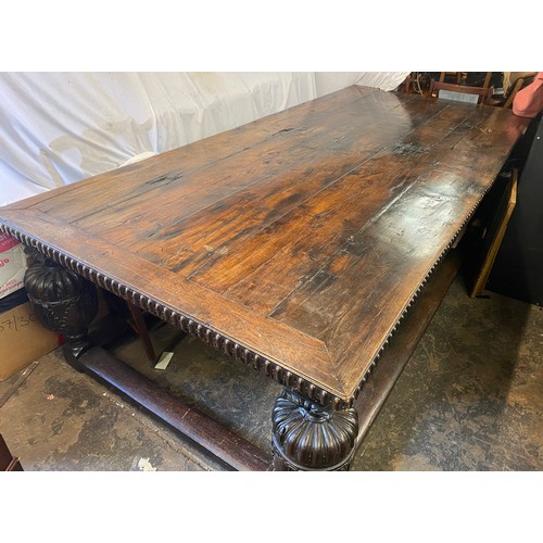 166 - 17TH CENTURY AND LATER OAK REFECTORY TABLE WITH A FIVE PLANK CLEATED TOP WITH CARVED EDGE ON HEAVILY... 