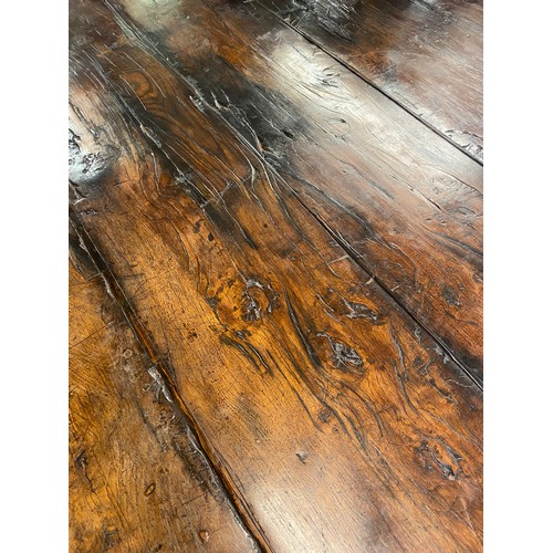 166 - 17TH CENTURY AND LATER OAK REFECTORY TABLE WITH A FIVE PLANK CLEATED TOP WITH CARVED EDGE ON HEAVILY... 