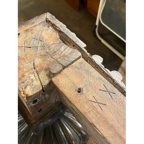 166 - 17TH CENTURY AND LATER OAK REFECTORY TABLE WITH A FIVE PLANK CLEATED TOP WITH CARVED EDGE ON HEAVILY... 