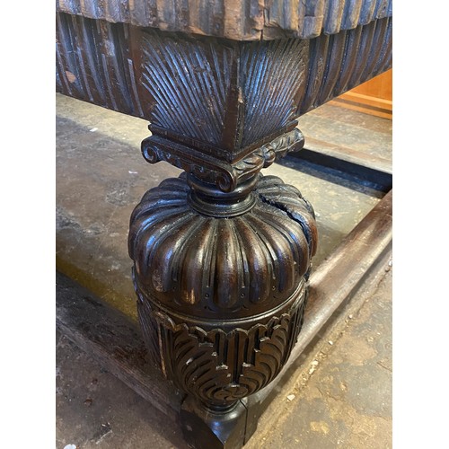 166 - 17TH CENTURY AND LATER OAK REFECTORY TABLE WITH A FIVE PLANK CLEATED TOP WITH CARVED EDGE ON HEAVILY... 