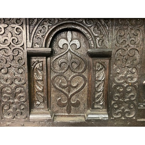 203 - 17TH CENTURY GOTHIC CARVED OAK CLOSED CUPBOARD, 143CM W X 180CM H X 61CM D APPROX