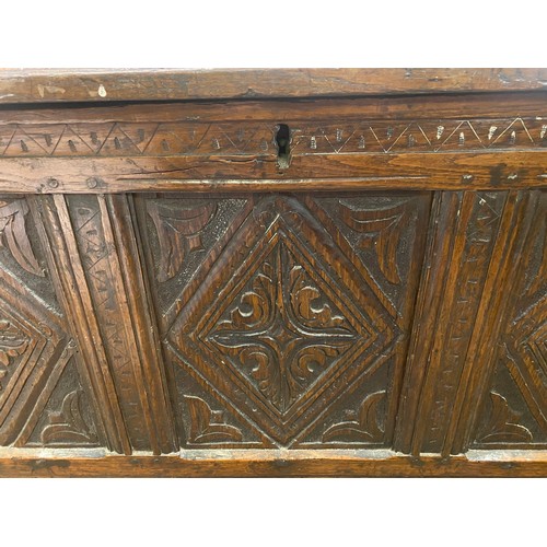 128 - 17TH CENTURY OAK THREE PANEL COFFER WITH CHIP CARVED DECORATION, 47CM D X 66CM H X 120CM WIDEST APPR... 