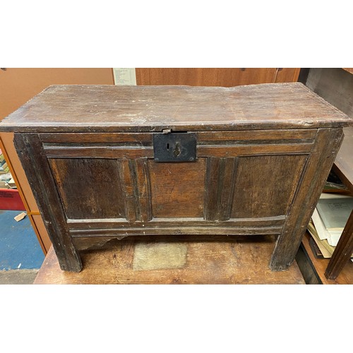 58 - 17TH CENTURY OAK THREE PANEL COFFER RAISED ON STILE FEET, 102.5CM W X 71CM H X 40CM D APPROX