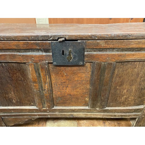 58 - 17TH CENTURY OAK THREE PANEL COFFER RAISED ON STILE FEET, 102.5CM W X 71CM H X 40CM D APPROX