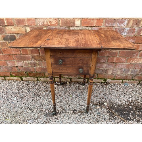 144 - REGENCY MAHOGANY AND EBONY STRUNG DROP FLAP TABLE ON RING TURNED TAPERED LEGS