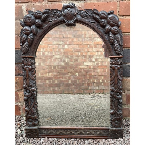 235 - HEAVILY CARVED ARCHED MIRROR