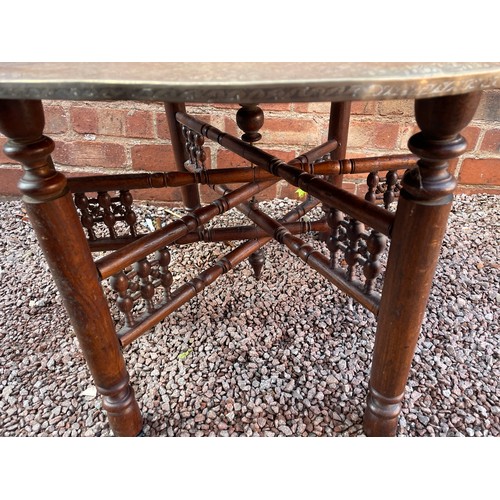 244 - BRASS ENGRAVED EASTERN TRAY TOP TABLE ON FOLDING STAND