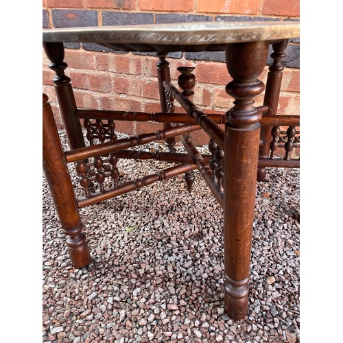 244 - BRASS ENGRAVED EASTERN TRAY TOP TABLE ON FOLDING STAND