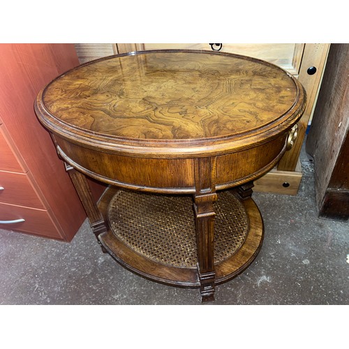 180 - WALNUT EFFECT OVAL OCASSIONAL TABLE WITH CANED UNDERTIER