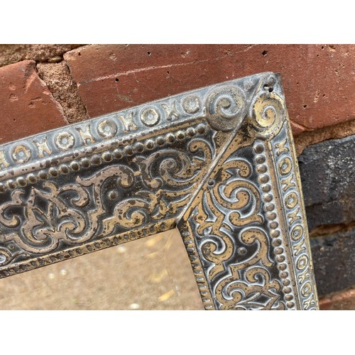 252 - EASTERN METAL REPOUSSE FRAMED RECTANGULAR BEVEL PLATE MIRROR