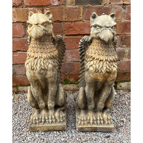 394 - PAIR OF STONEWORK SEATED GRIFFINS 56cm H