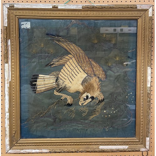 288 - QUILTED NEEDLEWORK AND EMBROIDERED PANEL OF A BIRD OF PRAY FRAMED AND GLAZED 48CM X 48 CM APPROX