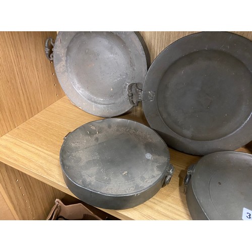 366 - FIVE 19TH CENTURY PEWTER WARMING PLATES