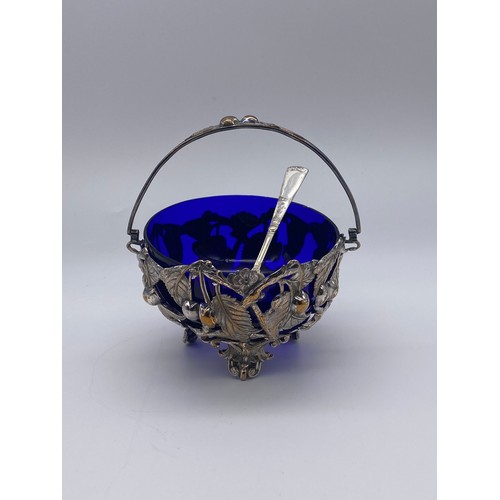 405 - BRISTOL BLUE GLASS LINED FILIGREE LEAF AND BERRY METAL ENCASED SUCRIER WITH UNMARKED SIFTER SPOON