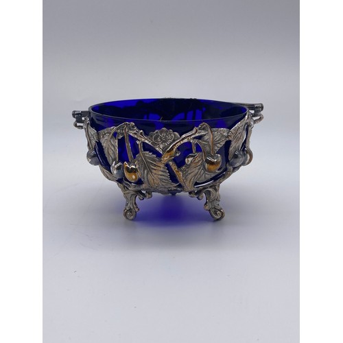 405 - BRISTOL BLUE GLASS LINED FILIGREE LEAF AND BERRY METAL ENCASED SUCRIER WITH UNMARKED SIFTER SPOON