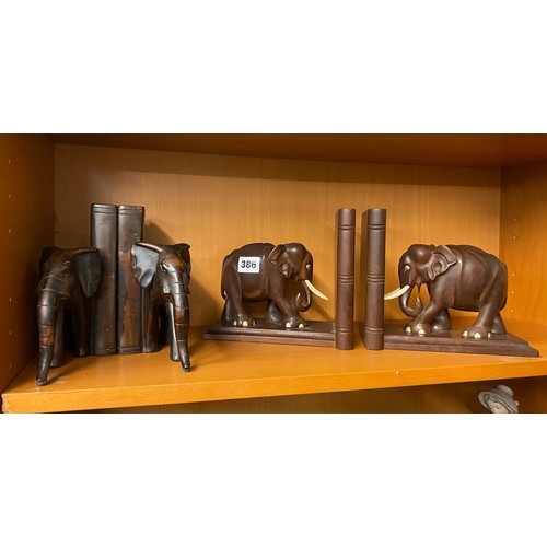 386 - TWO PAIRS OF CARVED ELEPHANT BOOKENDS