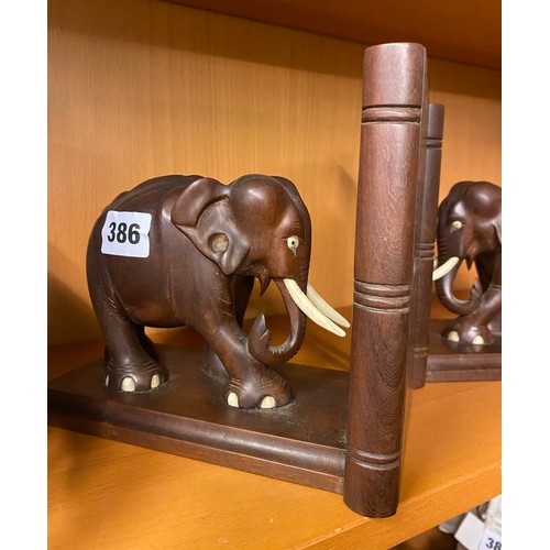 386 - TWO PAIRS OF CARVED ELEPHANT BOOKENDS