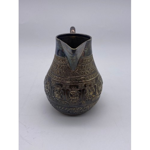 436 - UNMARKED EASTERN METALWARE JUG DECORATED WITH ASTROLOGICAL MEDALLIONS