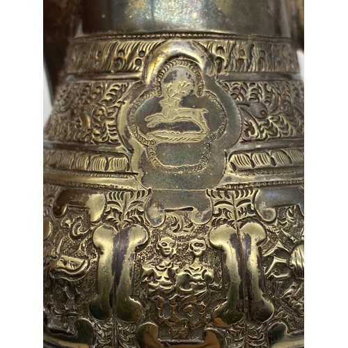 436 - UNMARKED EASTERN METALWARE JUG DECORATED WITH ASTROLOGICAL MEDALLIONS