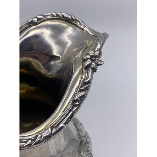 445 - GEORGIAN SILVER CREAM JUG WITH FOLIATE HANDLE 9.4 OZ APPROX