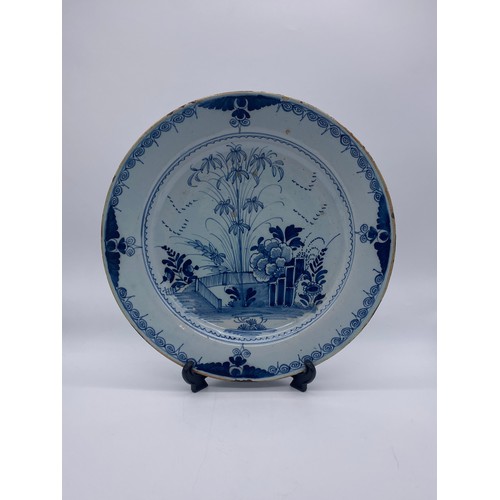 473 - 18TH CENTURY DELFT BLUE AND WHITE EARTHEN WARE CHARGER