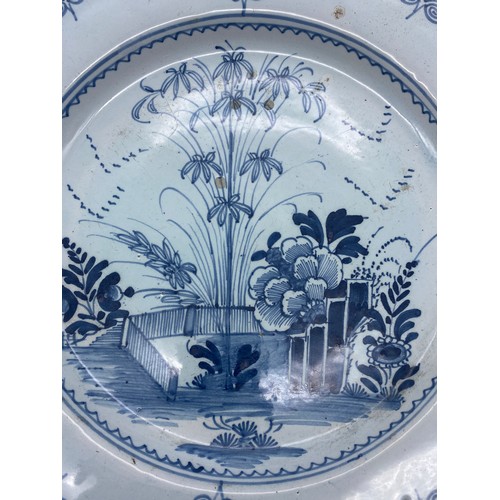 473 - 18TH CENTURY DELFT BLUE AND WHITE EARTHEN WARE CHARGER