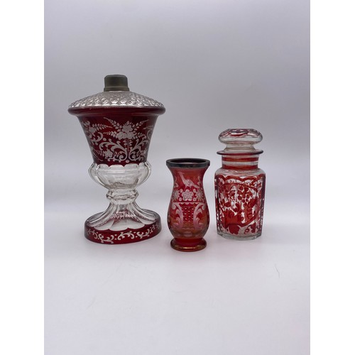 499 - BOHEMIAN RUBY ETCHED PANELLED LAMP BASE, RUBY ETCHED VASE WITH SILVER COLLAR AND A GRAPE VINE DECORA... 