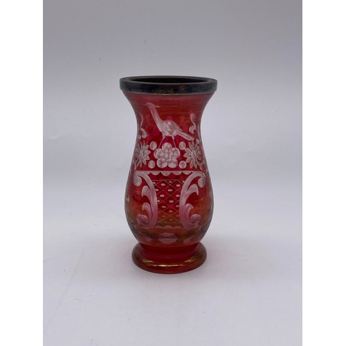 499 - BOHEMIAN RUBY ETCHED PANELLED LAMP BASE, RUBY ETCHED VASE WITH SILVER COLLAR AND A GRAPE VINE DECORA... 