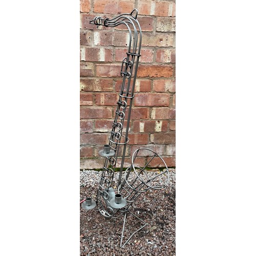 320 - METAL WORK STANDING SAXOPHONE CANDLE HOLDER