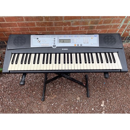 508 - YAMAHA ELECTRIC KEYBOARD AND FOLDING STAND