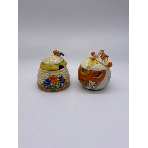 348 - CLARICE CLIFF BIZARRE CROCUS HONEY SKEP PRESERVE JAR AND BIZARRE RHODANTHE PRESERVE JAR