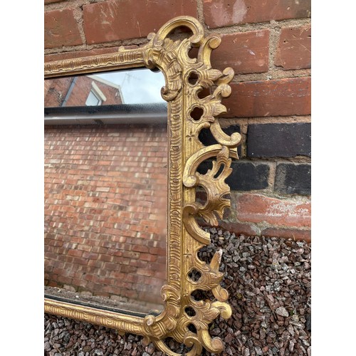 251 - GEORGE II STYLE GILT ACANTHUS AND SCROLL FRAMED MIRROR A/F, 110CM L X 61CM W APPROX