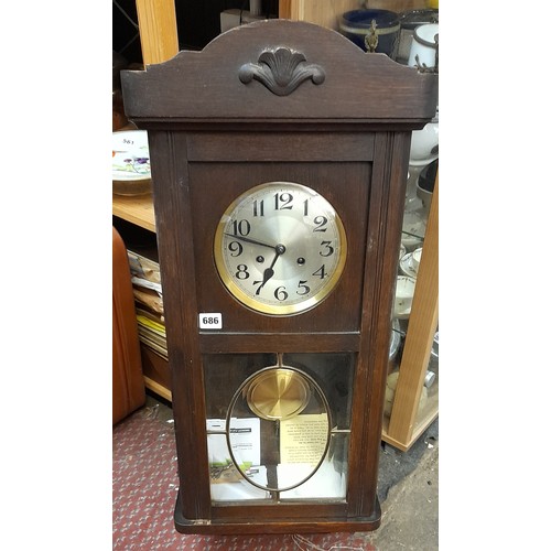 686 - 1930S OAK CASED PENDULUM WALL CLOCK