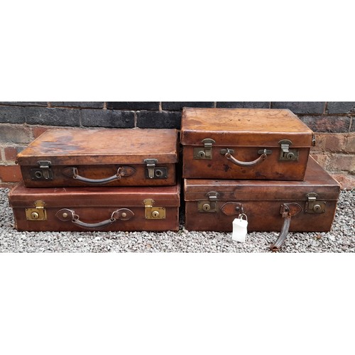 178 - SET OF FOUR EARLY 20TH CENTURY STITCHED LEATHER SUITCASES