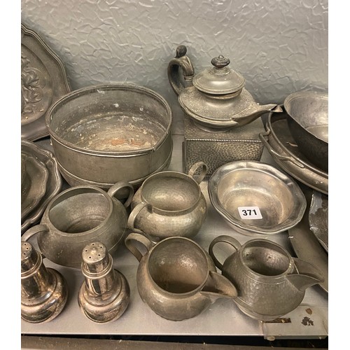 371 - SELECTION OF PEWTER BAS RELIEF PLATES, BEATEN PEWTER TEAWARES, BUTTER DISH AND COVER