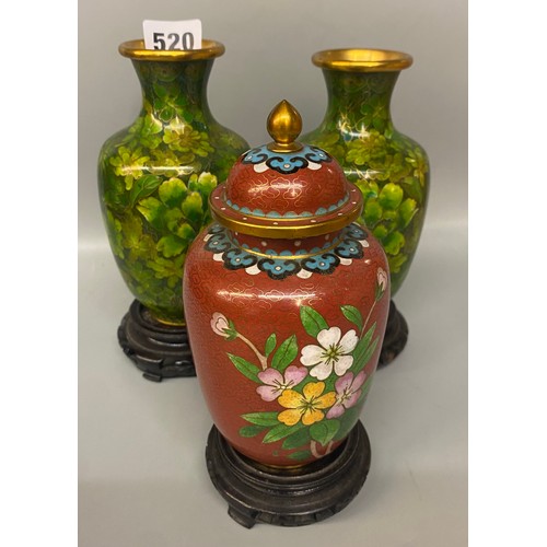 520 - PAIR OF GREEN CLOISONNE ENAMEL BALUSTER VASES ON HARDWOOD STANDS AND AN OVOID JAR WITH COVER ON HARD... 