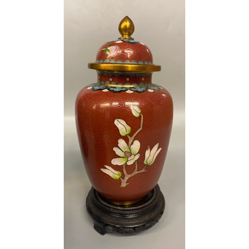 520 - PAIR OF GREEN CLOISONNE ENAMEL BALUSTER VASES ON HARDWOOD STANDS AND AN OVOID JAR WITH COVER ON HARD... 