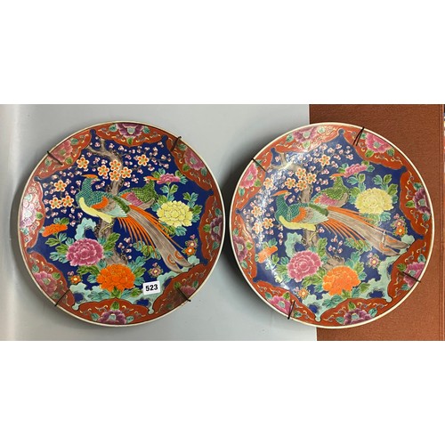 523 - PAIR OF 20TH CENTURY JAPANESE DECORATIVE WALL CHARGERS PAINTED WITH EXOTIC BIRDS AMIDST BLOSSOM