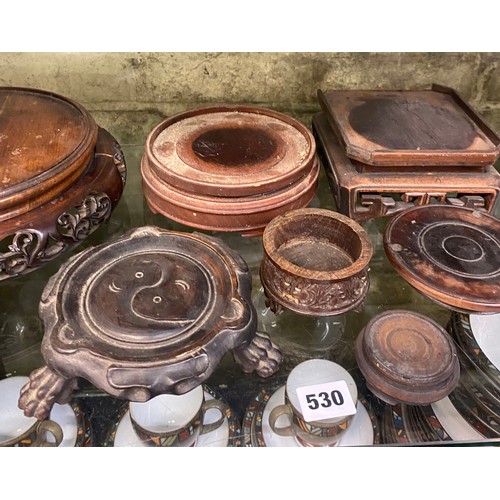 530 - SELECTION OF ORIENTAL CARVED HARDWOOD VASE AND BOWL STANDS