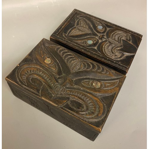 533 - TWO CARVED HARDWOOD BOXES, MAORI INSPIRED WITH PAUA SHELL INSET EYES