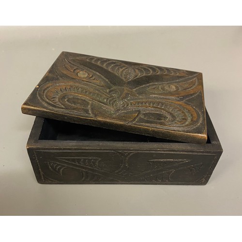 533 - TWO CARVED HARDWOOD BOXES, MAORI INSPIRED WITH PAUA SHELL INSET EYES