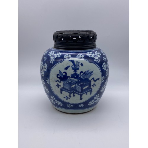 754 - CHINESE BLUE AND WHITE VASE WITH HARD WOOD COVER DECORATED WITH PANELS OF ATTRIBUTES ON PRUNUS FLORA... 