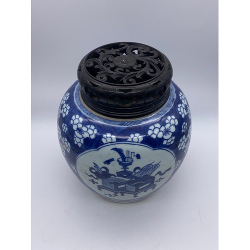 754 - CHINESE BLUE AND WHITE VASE WITH HARD WOOD COVER DECORATED WITH PANELS OF ATTRIBUTES ON PRUNUS FLORA... 