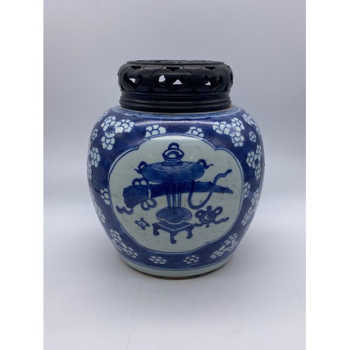 754 - CHINESE BLUE AND WHITE VASE WITH HARD WOOD COVER DECORATED WITH PANELS OF ATTRIBUTES ON PRUNUS FLORA... 